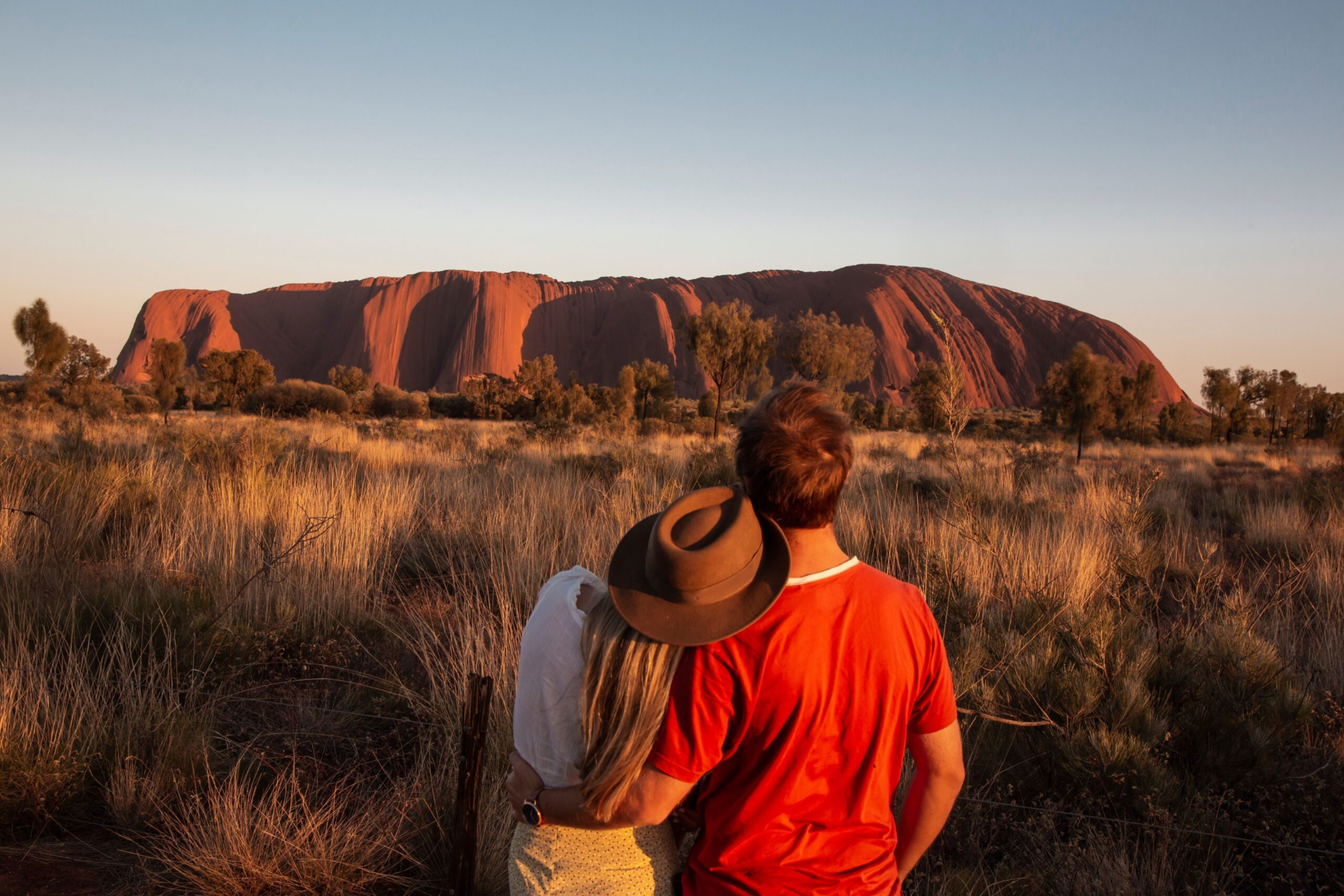 130202-35_Couple-at-Uluru-Sunrise_Tourism-Australia_Nicholas-Kavo-scaled